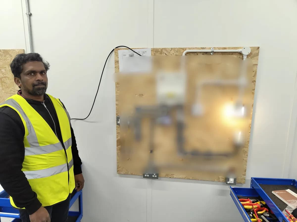 Three students celebrating passing their 2365 Level 2 assessment at Total Skills Nottingham training centre